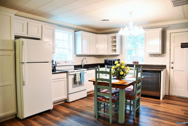 kitchen with hanging light fixtures, dark wood-type flooring, white appliances, white cabinets, and ornamental molding