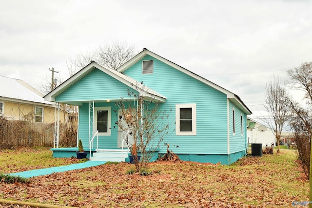 bungalow-style home with central AC and a porch