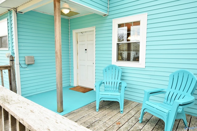 entrance to property featuring a wooden deck