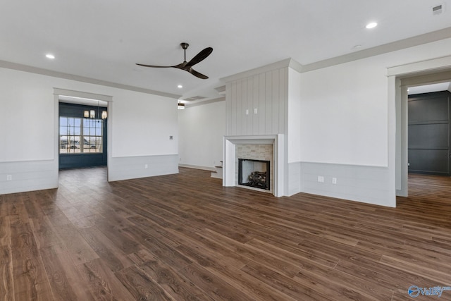 unfurnished living room with dark hardwood / wood-style flooring and ceiling fan