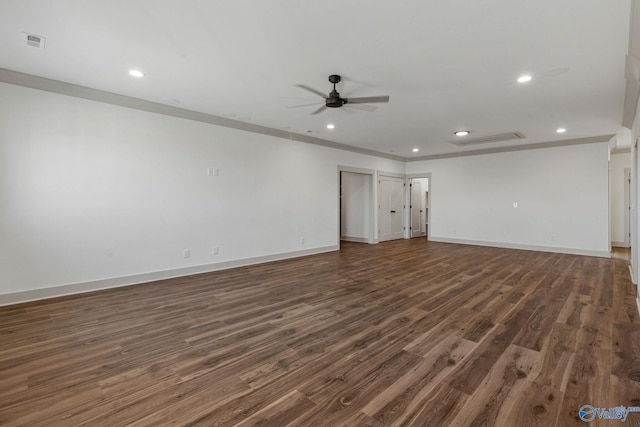 unfurnished room with crown molding, ceiling fan, and dark hardwood / wood-style flooring