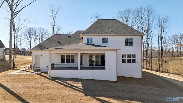 rear view of house with a porch