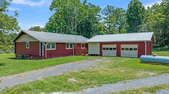 ranch-style house featuring central AC unit and a front yard