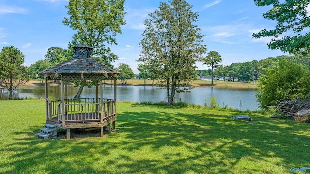 view of yard featuring a water view and a gazebo