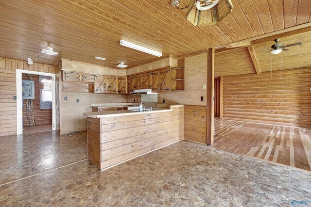 kitchen featuring sink, tile patterned floors, ceiling fan, and wood ceiling