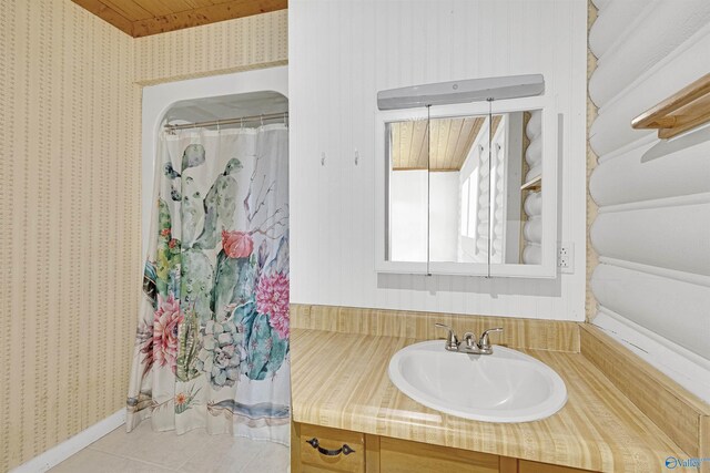 bathroom with vanity, wooden ceiling, and tile patterned flooring