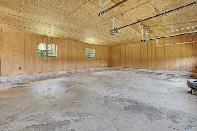 garage featuring wooden walls