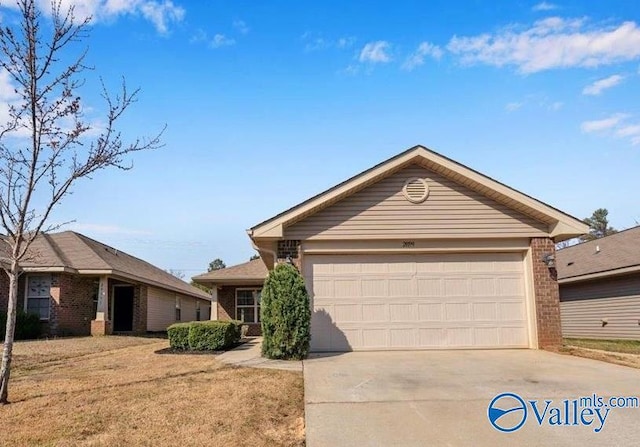 ranch-style home featuring brick siding, driveway, an attached garage, and a front lawn