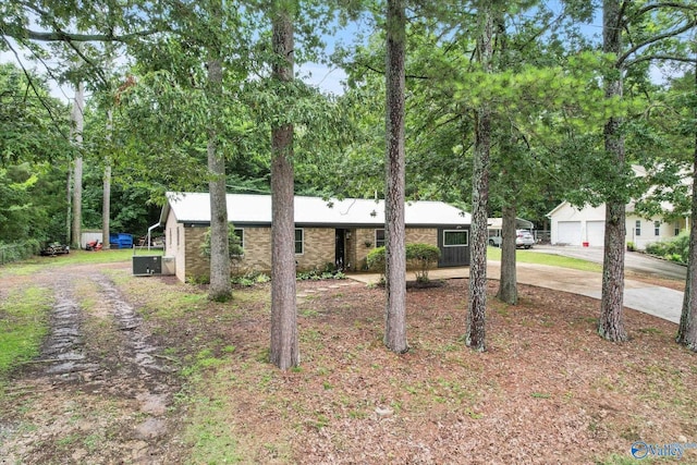 216 Mcdonald Ln, Guntersville, AL 35976 - view of front of house with driveway, brick siding, and a garage