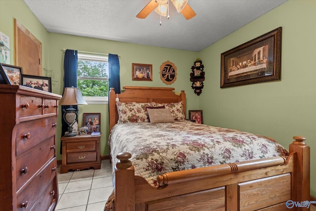 216 Mcdonald Ln, Guntersville, AL 35976 - bedroom featuring light tile patterned flooring, a textured ceiling, and a ceiling fan