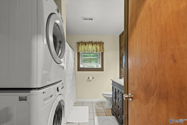 216 Mcdonald Ln, Guntersville, AL 35976 - laundry room featuring stacked washer and clothes dryer and light tile patterned floors