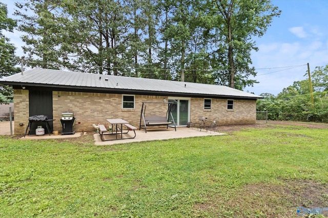 216 Mcdonald Ln, Guntersville, AL 35976 - back of house with a patio area and brick siding
