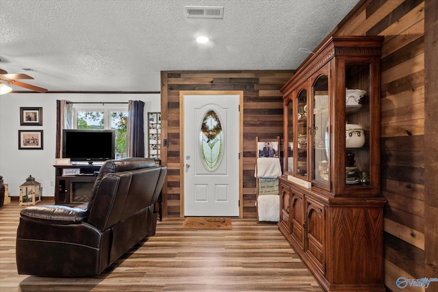 216 Mcdonald Ln, Guntersville, AL 35976 - foyer with a textured ceiling, ceiling fan, wood finished floors, and wood walls