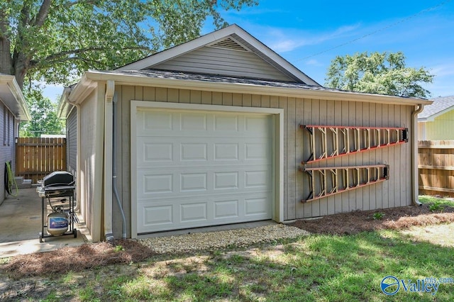 garage featuring fence