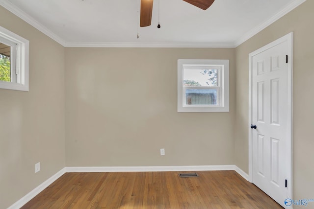 unfurnished room featuring a ceiling fan, baseboards, and wood finished floors