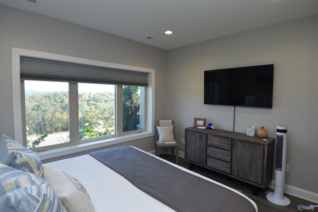 bedroom featuring dark hardwood / wood-style floors