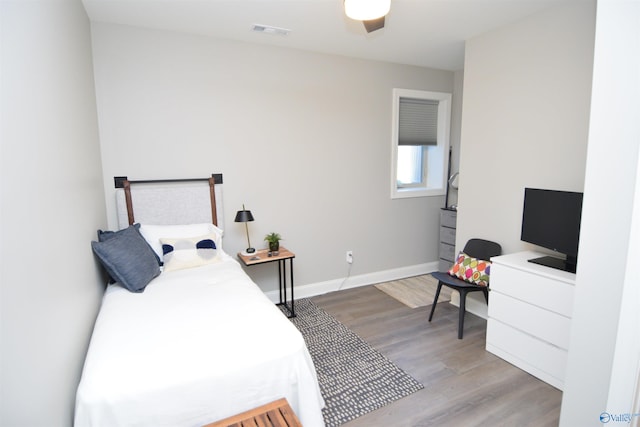 bedroom featuring ceiling fan and light hardwood / wood-style flooring