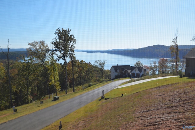 view of road featuring a water and mountain view