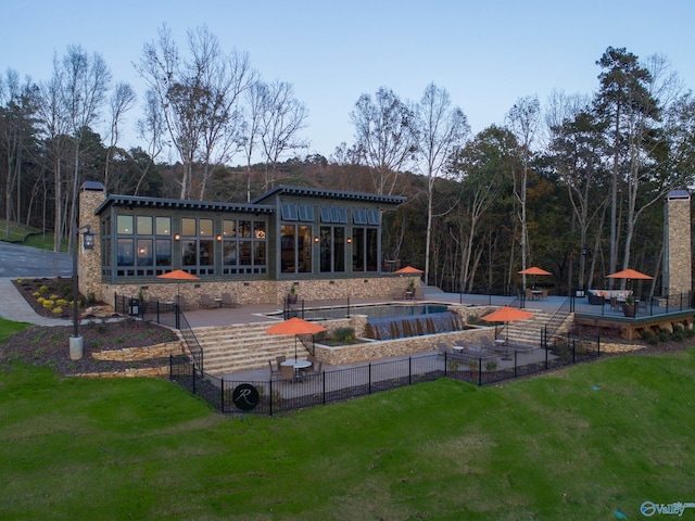 exterior space with a patio area and a lawn