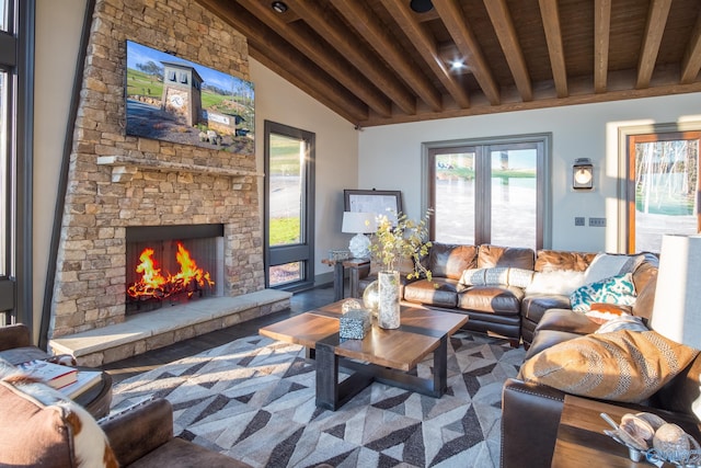 living room featuring hardwood / wood-style flooring, beamed ceiling, wooden ceiling, and a fireplace