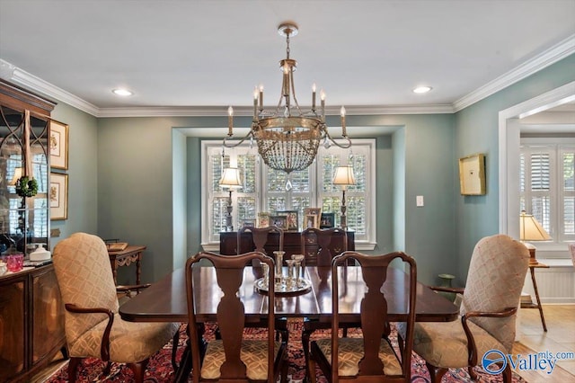 dining space featuring ornamental molding, light tile patterned floors, and an inviting chandelier