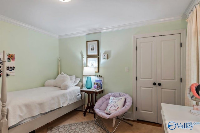 bedroom featuring a closet and crown molding