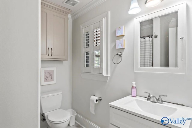 bathroom featuring vanity, toilet, and ornamental molding