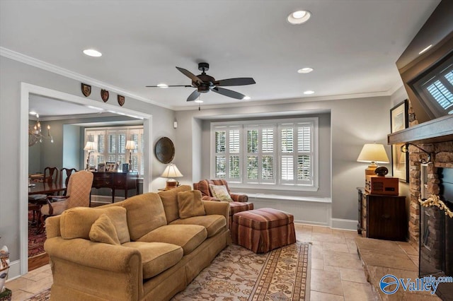 living room with ceiling fan, ornamental molding, and a stone fireplace