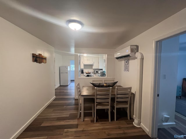 dining room with dark wood-type flooring and a wall mounted air conditioner