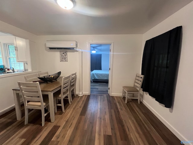 dining area featuring dark hardwood / wood-style floors and a wall mounted AC