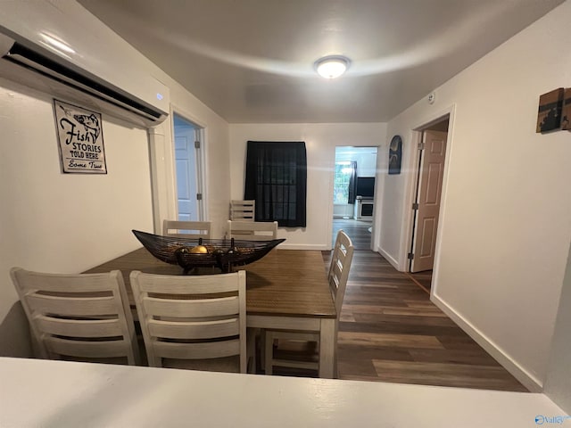 dining room with dark hardwood / wood-style flooring