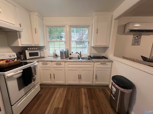 kitchen with sink, white cabinetry, dark wood-type flooring, and white appliances