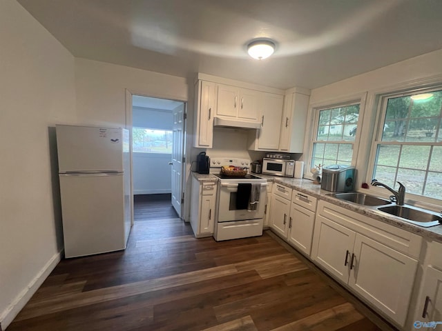 kitchen with white appliances, white cabinetry, sink, and dark hardwood / wood-style flooring