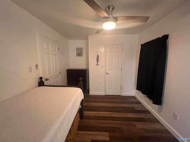 bedroom with ceiling fan and dark hardwood / wood-style flooring