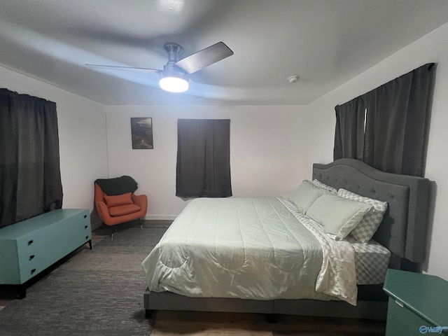 bedroom featuring dark hardwood / wood-style floors and ceiling fan