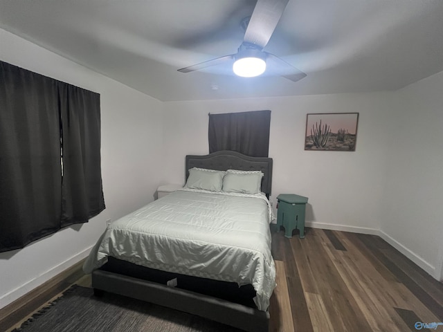 bedroom with ceiling fan and dark hardwood / wood-style flooring