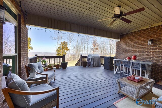 deck featuring a ceiling fan and area for grilling