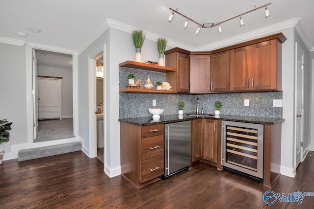 bar featuring wine cooler, dark wood-type flooring, refrigerator, wet bar, and a sink