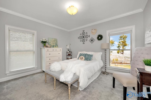 bedroom featuring light carpet, baseboards, and crown molding