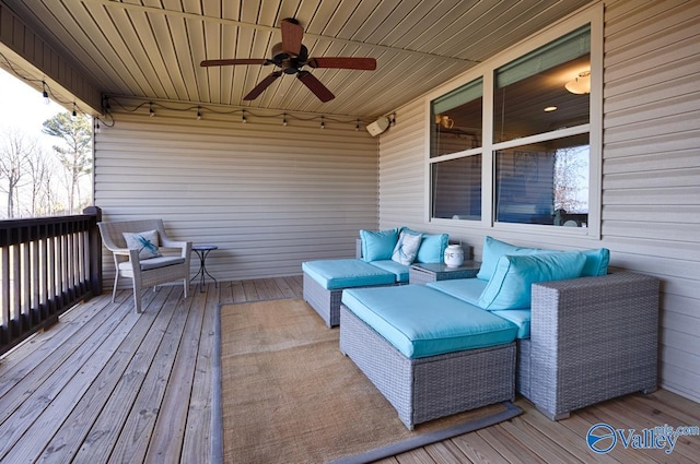 wooden terrace with a ceiling fan and an outdoor hangout area