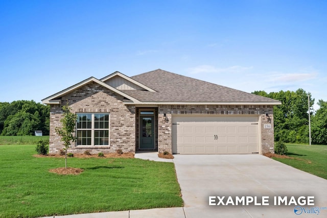 craftsman-style house featuring a front yard and a garage