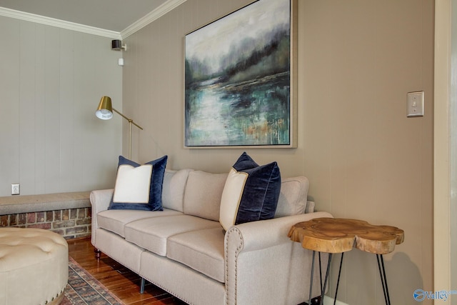 living area with crown molding and wood finished floors