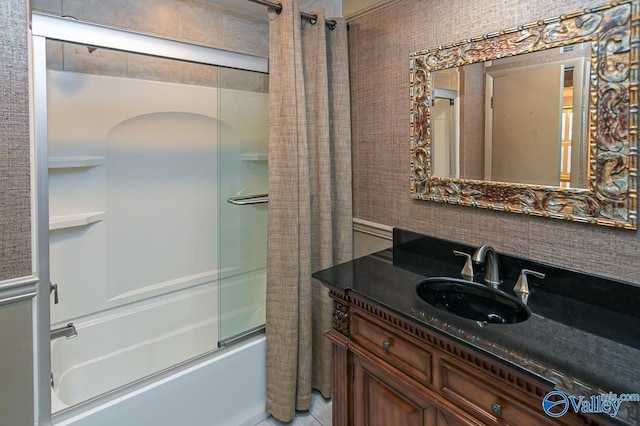 full bathroom with vanity, decorative backsplash, and bath / shower combo with glass door