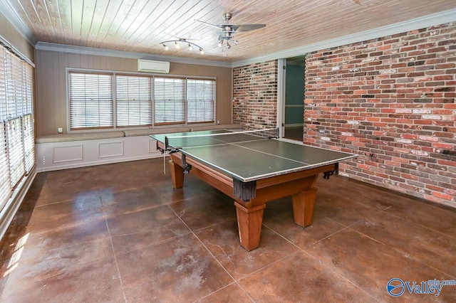 rec room featuring ceiling fan, wooden ceiling, brick wall, a wall mounted air conditioner, and crown molding