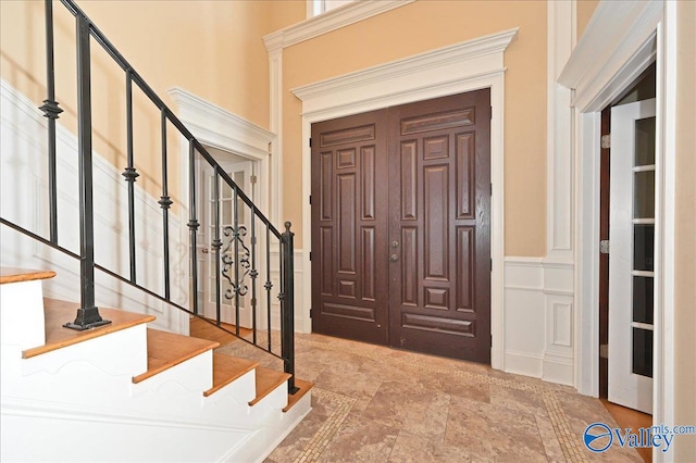 entrance foyer featuring tile patterned flooring