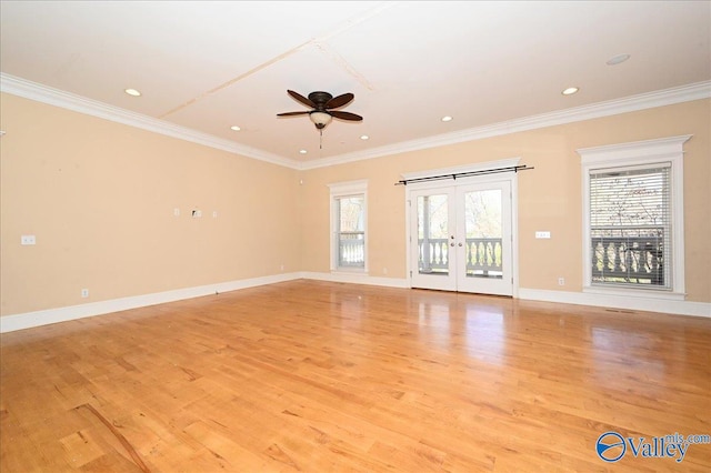 unfurnished living room with light hardwood / wood-style floors, french doors, and plenty of natural light