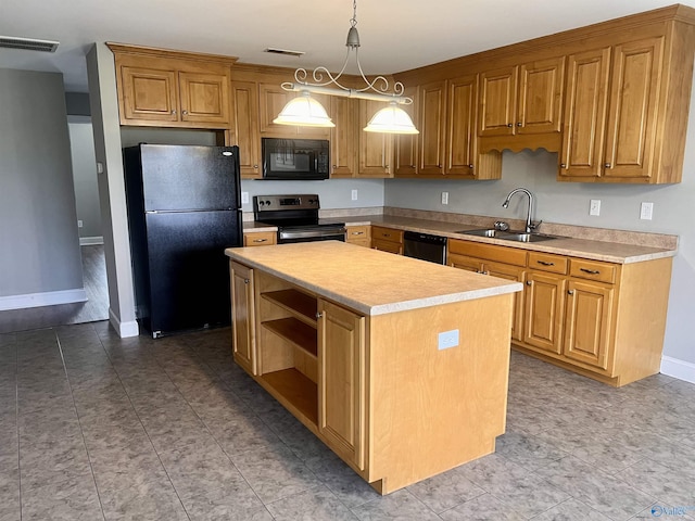 kitchen with sink, a kitchen island, black appliances, and decorative light fixtures