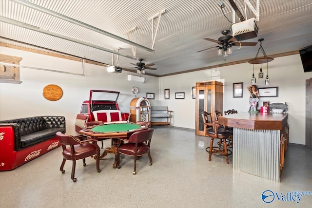 recreation room with baseboards, a ceiling fan, an AC wall unit, and speckled floor