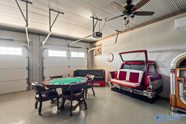 garage with a wall mounted air conditioner, a ceiling fan, and a garage door opener