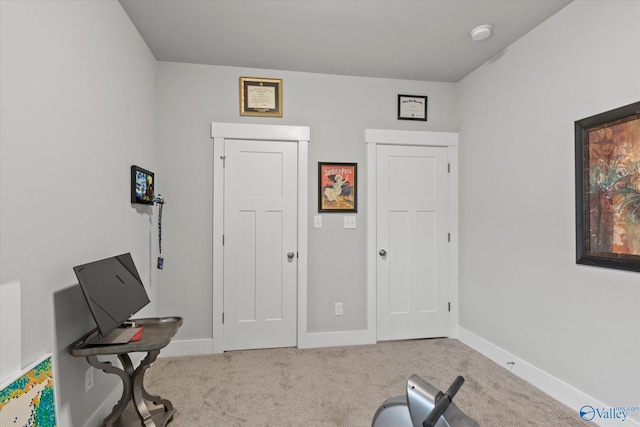 workout area with light colored carpet